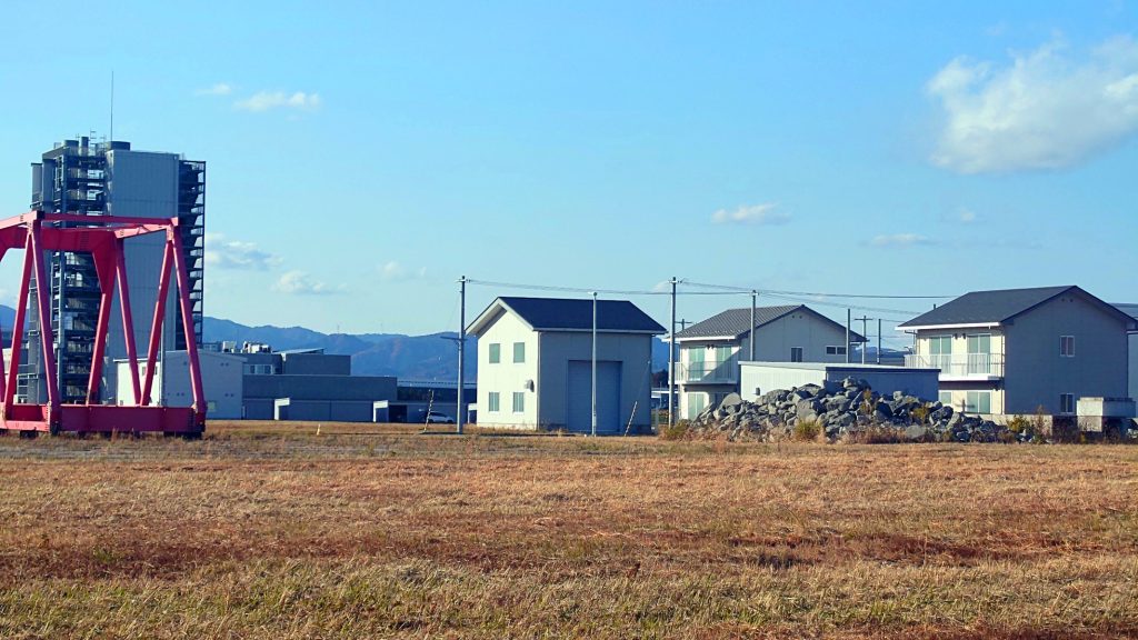 Plant, houses, and debris field